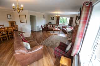 The open-plan living and dining space at Castle View Lodge