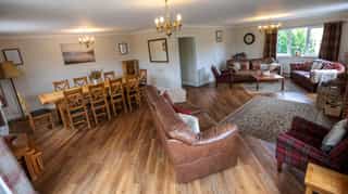 The open-plan living and dining space at Castle View Lodge