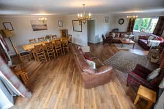 The open-plan living and dining space at Castle View Lodge