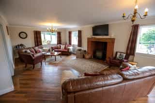 The open-plan living and dining space at Castle View Lodge