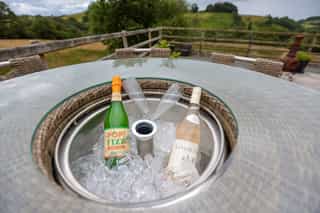 A fizz-on-ice welcome with a countryside view at Castle View Lodge
