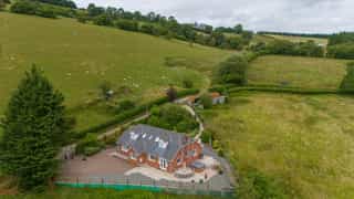Aerial view of Castle View Lodge and the surrounding hills