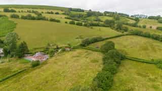 Aerial view of Castle View Lodge and the surrounding hills