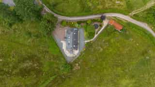 Aerial view of Castle View Lodge and the surrounding hills
