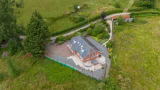 Aerial view of Castle View Lodge and the surrounding hills