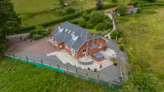 Aerial view of Castle View Lodge and the surrounding hills