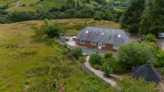 Aerial view of Castle View Lodge and the surrounding hills