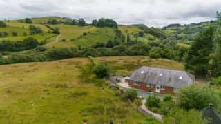 Aerial view of Castle View Lodge and the surrounding hills