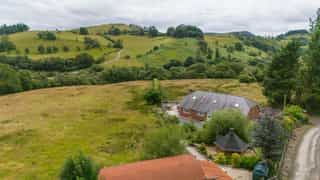 Aerial view of Castle View Lodge nestled in the hills