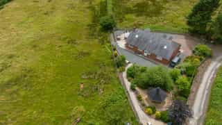 Aerial view of Castle View Lodge and the surrounding hills