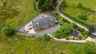 Aerial view of Castle View Lodge and the surrounding hills