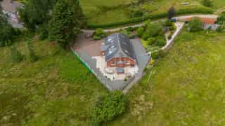 Aerial view of Castle View Lodge and the surrounding hills