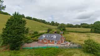 Aerial view of Castle View Lodge and the surrounding hills