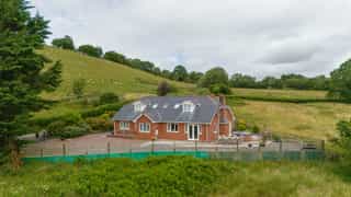 Aerial view of Castle View Lodge and the surrounding hills