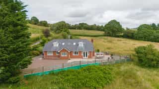 Aerial view of Castle View Lodge and the surrounding hills