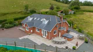 Aerial view of Castle View Lodge and the surrounding hills