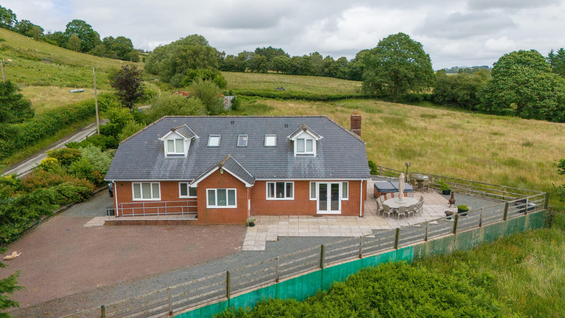 Aerial view of Castle View Lodge in its hillside setting